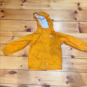 REI 3T orange rain jacket